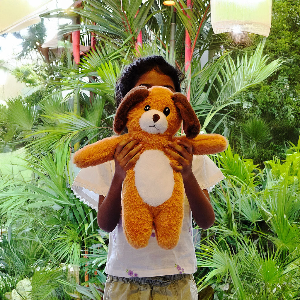 SnuggyBuggy's Jr Coco the Dog, a soft and mini plush toy with floppy ears, perfect for little hands to hug and play with.