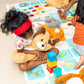 Children playing with toys on a colorful mat