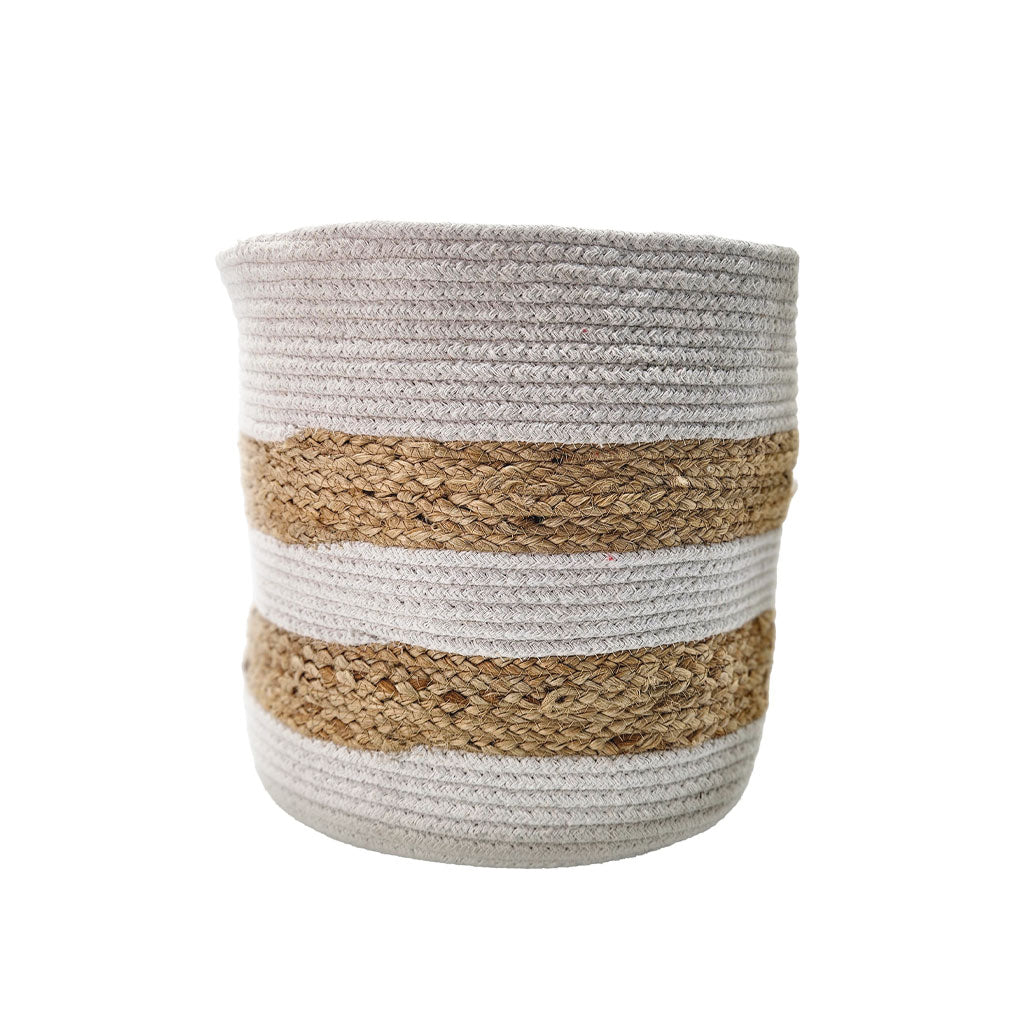 Round dual-color storage basket made of braided cotton rope and natural jute, featuring beige and white horizontal bands, used for home organization and décor.