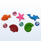 Set of colorful sea-themed rubber stamps on a white background